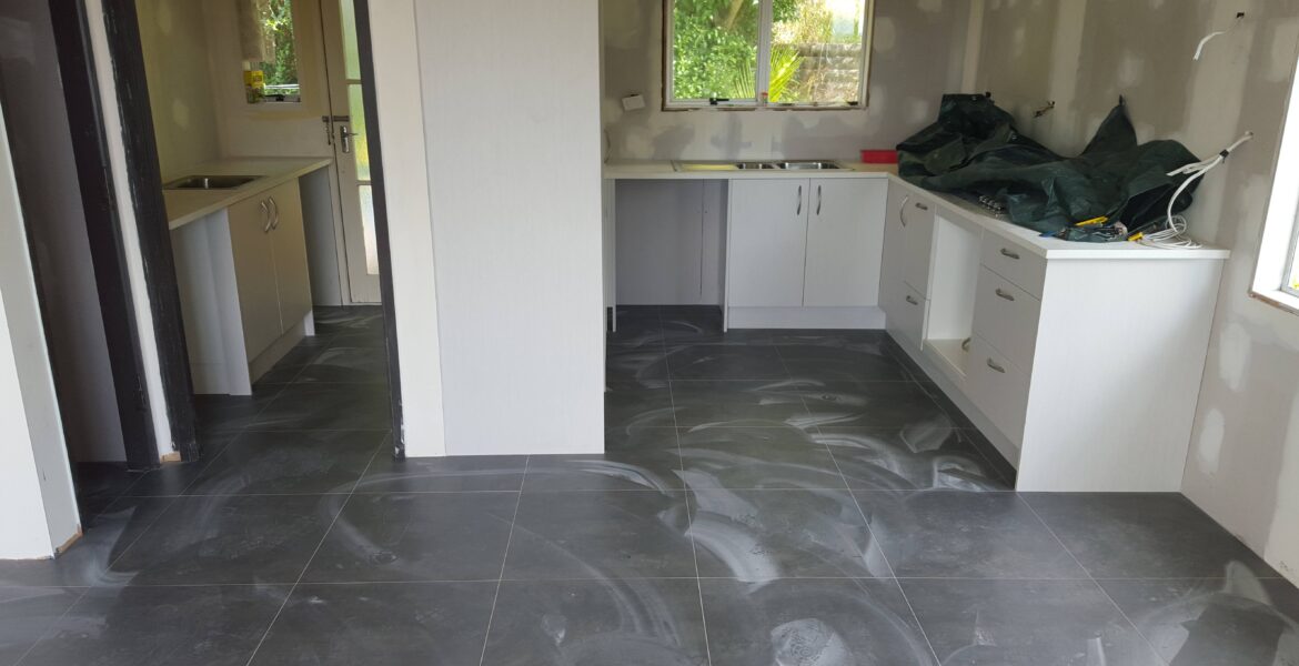 Kitchen in progress, recently tiled, walls plastered.