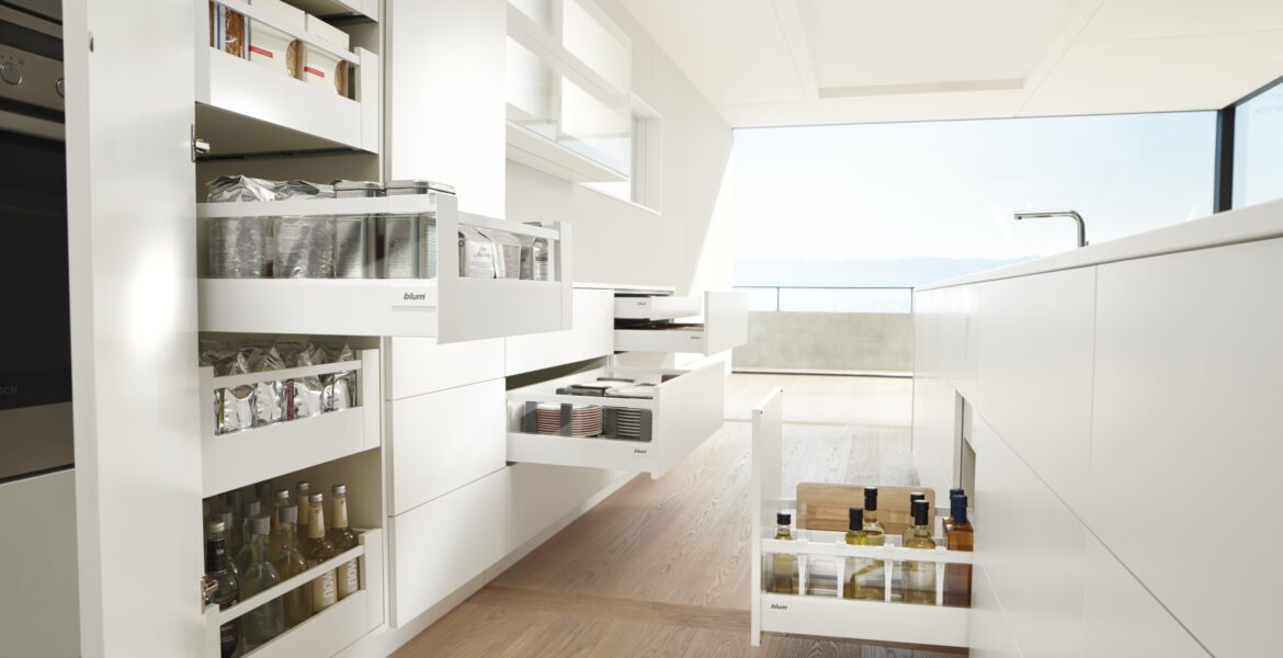 Modern kitchen with pantry pull-out shelves open.
