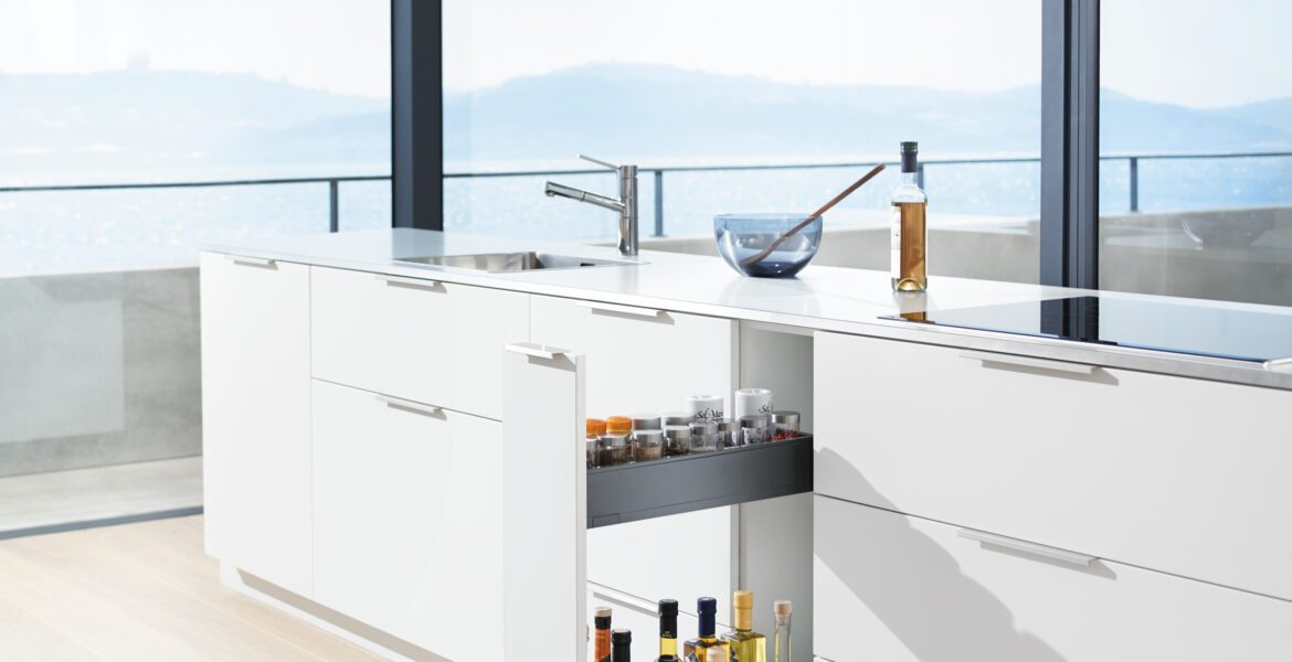 Kitchen with ocean view showcasing a pull out space rack