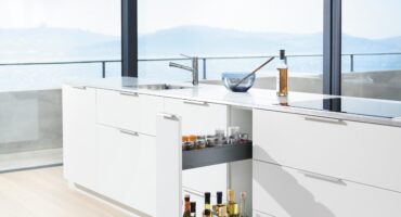 Kitchen with ocean view showcasing a pull out space rack