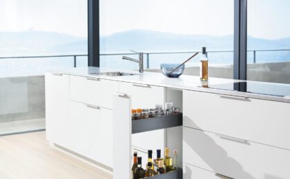 Kitchen with ocean view showcasing a pull out space rack