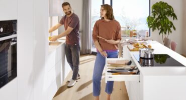 Sleek kitchen with minimalist design, push to open drawers and no handles.