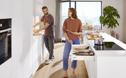 Sleek kitchen with minimalist design, push to open drawers and no handles.
